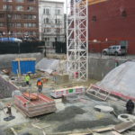 60 West Cordova Street's worksite is being set up by construction workers.